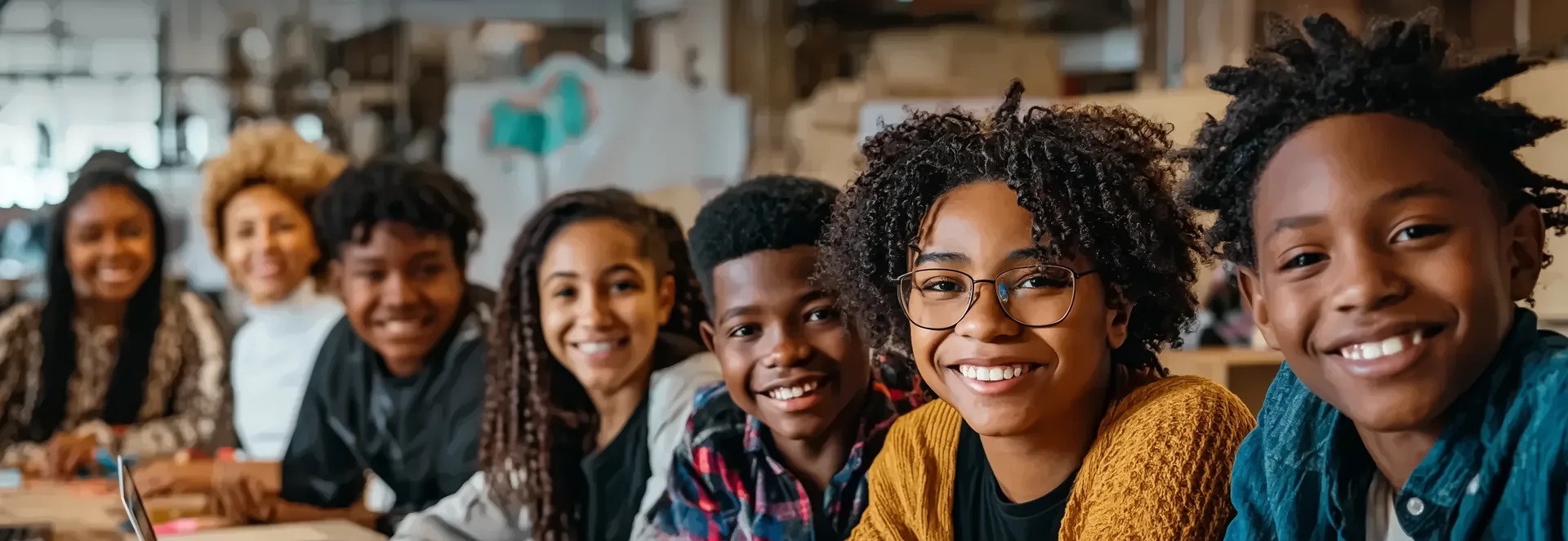 Black and Afro-Latino middle-school students smiling together